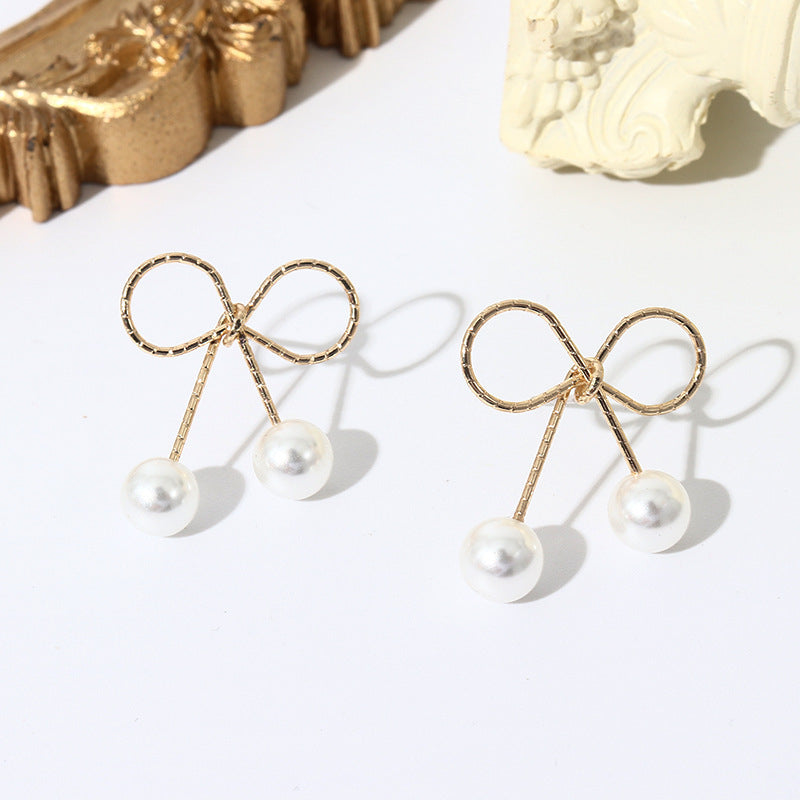 Pearl Bow Elegance Clip-On Earrings